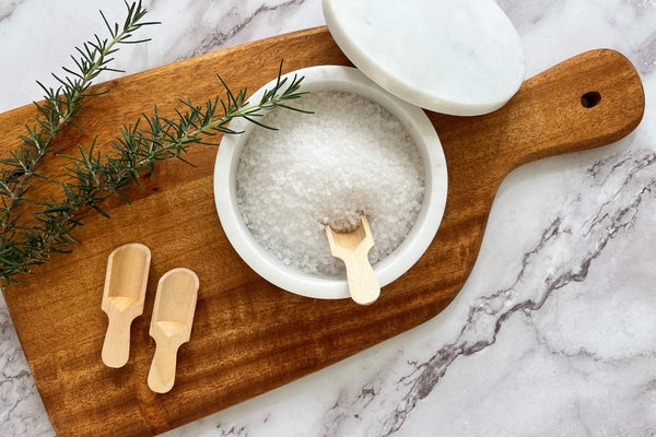 Wooden Chopping Board with salt and rosemary featured.