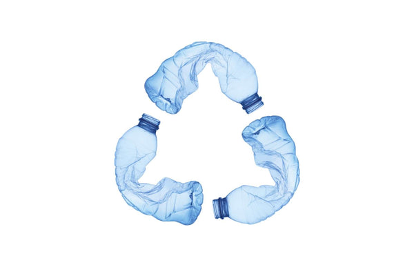Plastic bottles in the shape of the recycling icon.