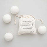 wool dryer balls in bag and surrounding bag